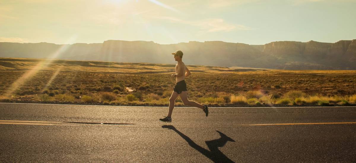 health benefits to running illustrated via line drawing: heart, brain, lungs, and legs labeled with icons showing strengthened function
